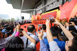 Các nhà báo tác nghiệp tại Hội báo toàn quốc 2018. (Ảnh: Minh Sơn/Vietnam+) 