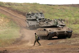 Binh sỹ Israel tham gia một cuộc tập trận tại khu vực cao nguyên Golan. (Nguồn: AFP/TTXVN)