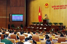 Quốc hội biểu quyết thông qua Luật sửa đổi, bổ sung một số điều của Luật Giáo dục đại học. (Ảnh: Nguyễn Dân/TTXVN)