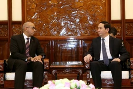 Chủ tịch nước Trần Đại Quang tiếp Đại sứ đặc mệnh toàn quyền Cuba tại Việt Nam Herminio López Díaz. (Ảnh: Nhan Sáng/TTXVN)