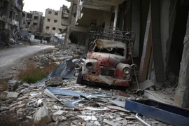 Cảnh đổ nát sau các cuộc giao tranh giữa quân đội chính phủ Syria và phiến quân tại Jobar, ngoại ô thủ đô Damascus ngày 23/1. (Nguồn: AFP/TTXVN)