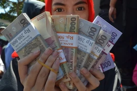 Đồng rupiah của Indonesia. (Nguồn: AFP/TTXVN)