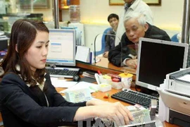 Sacombank triển khai gói tài khoản an sinh xã hội miễn phí. (Ảnh: Vietnam+)