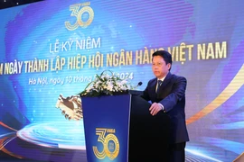 Phó Thống đốc Ngân hàng Nhà nước Phạm Tiến Dũng phát biểu tại lễ kỷ niệm. (Ảnh: Vietnam+)