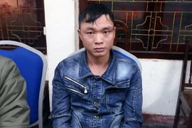 Đối tượng Nguyễn Khanh Oanh tại cơ quan điều tra. (Ảnh: Nguyễn Hoàng/TTXVN)