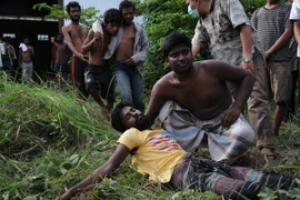 Người di cư tại khu vực lều tạm ở Kuala Langsa, tỉnh Aceh, Indonesia ngày 15/5, sau khi được cứu sống trên biển. Ảnh minh họa. (Nguồn; AFP/TTXVN)