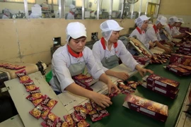 Dây chuyền sản xuất bánh quy tại nhà máy của Công ty Cổ phần Bánh kẹo Biên Hòa. (Ảnh: Vũ Sinh/TTXVN)