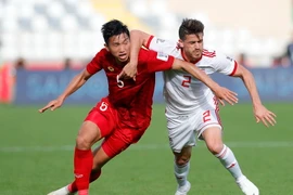 Văn Hậu và đồng đội đã nỗ lực rất nhiều trước Iran. (Ảnh: THX/TTXVN)