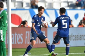 Yuya Osako (số 15) lập cú đúp giúp Nhật Bản ngược dòng thành công. (Nguồn: AFC)