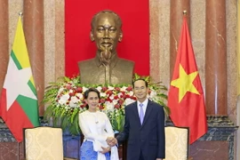Chủ tịch nước Trần Đại Quang tiếp Cố vấn Nhà nước Myanmar Aung San Suu Kyi. (Ảnh: Nhan Sáng/TTXVN)