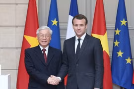 Tổng Bí thư Nguyễn Phú Trọng và Tổng thống Cộng hòa Pháp Emmanuel Macron. (Ảnh: Trí Dũng/TTXVN)