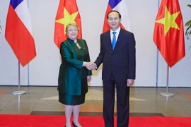 Chủ tịch nước Trần Đại Quang tổ chức Quốc yến chiêu đãi trọng thể Tổng thống Michelle Bachelet Jeria cùng các thành viên trong Đoàn đại biểu cấp cao Cộng hòa Chile thăm cấp Nhà nước tới Việt Nam. (Ảnh: Nhan Sáng/TTXVN)