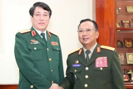 Quang cảnh lễ đón Thượng tướng Lương Cường. (Ảnh: Phạm Kiên/TTXVN)