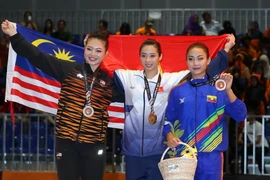 Thúy Vy (giữa) lại giành HCV cho Việt Nam. (Ảnh: Quốc Khánh/TTXVN)