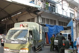 Địa điểm sản xuất đĩa lậu tại nhà kho 360B Bến Vân Đồn. (Ảnh: Thế Vinh/TTXVN) 