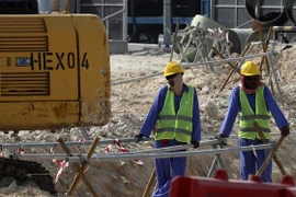 Công nhân làm việc tại một công trường xây dựng. (Ảnh minh họa. AFP/TTXVN)