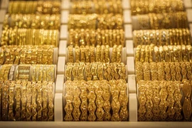 Giá vàng châu Á biến động nhẹ do thị trường kỳ vọng Fed tăng lãi suất