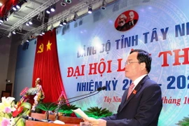 Bí thư Tỉnh ủy Tây Ninh Trần Lưu Quang phát biểu nhận nhiệm vụ tại phiên bế mạc Đại hội. (Ảnh: Lê Đức Hoảnh/TTXVN)