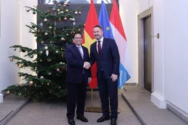 Thủ tướng Chính phủ Phạm Minh Chính và Thủ tướng Luxembourg Xavier Bettel. (Ảnh: Dương Giang/TTXVN)
