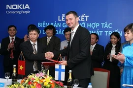 Quang cảnh buổi lễ ký kết (Ảnh: PV/Vietnam+)