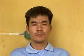 Đối tượng Tính tại cơ quan công an. (Ảnh: TTXVN phát)