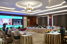 Quang cảnh cuộc họp tại điểm cầu Hà Nội. (Ảnh: Hồng Pha/TTXVN phát)