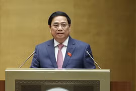 Thủ tướng Phạm Minh Chính trình bày Báo cáo kết quả thực hiện kế hoạch phát triển kinh tế-xã hội năm 2022; dự kiến kế hoạch phát triển kinh tế-xã hội năm 2023. (Ảnh: Dương Giang/TTXVN)