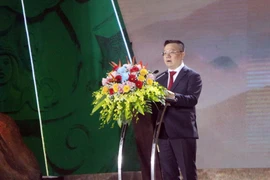 Tổng Biên tập Báo Nhân dân, Chủ tịch Hội Nhà báo Việt Nam Lê Quốc Minh phát biểu khai mạc chương trình. (Ảnh: Tá Chuyên/TTXVN)