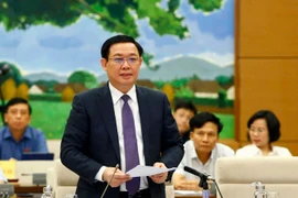 Phó Thủ tướng Chính phủ Vương Đình Huệ phát biểu làm rõ thêm một số vấn đề liên quan thuộc trách nhiệm của Chính phủ và trực tiếp trả lời chất vấn của đại biểu Quốc hội. (Ảnh: Văn Điệp/TTXVN)