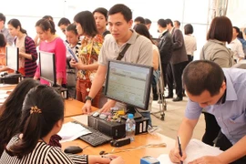 Thu ngân sách năm 2015 dự kiến vượt hơn 13% so với năm 2014. (Ảnh: PV/Vietnam+)