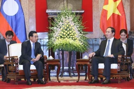 Chủ tịch nước Trần Đại Quang tiếp Phó Chủ tịch nước Cộng hòa Dân chủ Nhân dân Lào. (Ảnh: Nhan Sáng/TTXVN)