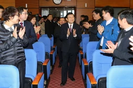 Chủ tịch nước Trương Tấn Sang đến thăm, chúc Tết cán bộ, nhân viên Tập đoàn Dầu khí Quốc gia Việt Nam. (Ảnh: Nguyễn Khang/TTXVN)