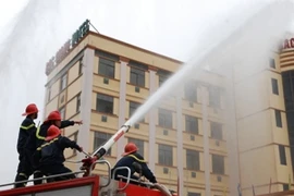 Diễn tập chữa cháy tại tuần lễ an toàn, vệ sinh lao động. (Ảnh minh họa: Danh Lam/TTXVN)