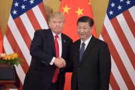 Tổng thống Mỹ Donald Trump (trái) và Chủ tịch Trung Quốc Tập Cận Bình tại Đại lễ đường Nhân dân ở Bắc Kinh. (Nguồn: AFP/TTXVN)