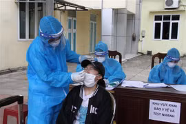 Xét nghiệm COVID-19 tại Nghệ An. (Ảnh minh họa: Văn Tý/TTXVN)
