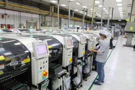 Hoạt động sản xuất tại Công ty Fuhong Precision Component tại Khu công nghiệp Đình Trám (vốn đầu tư của Đài Loan) tại Bắc Giang. (Ảnh: Danh Lam/TTXVN)