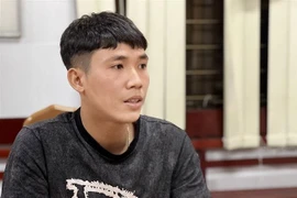 Đối tượng Trần Ngọc Diệp tại cơ quan điều tra. (Ảnh: TTXVN phát)