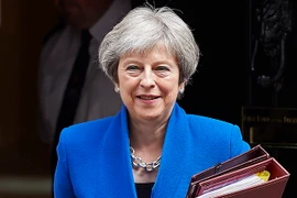 Thủ tướng Anh Theresa May tới dự phiên điều trần tại Hạ viện Anh ở thủ đô London ngày 20/6. (Ảnh: AFP/TTXVN)