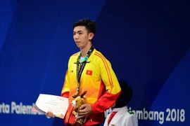 Vận động viên Nguyễn Huy Hoàng đoạt huy chương bạc nội dung bơi tự do 1.500m nam tại ASIAD 2018 diễn ra ở Jakarta, Indonesia ngày 24/8. (Ảnh: AFP/TTXVN)
