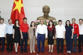 Thủ tướng Nguyễn Xuân Phúc với các đại biểu. (Ảnh: Thống Nhất/TTXVN)