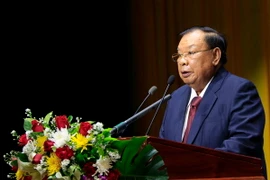 Tổng Bí thư, Chủ tịch nước Bounnhang Volachith phát biểu tại buổi lễ. (Ảnh: Phạm Kiên/TTXVN) 