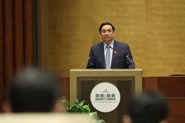 Thủ tướng Chính phủ nhiệm kỳ 2016-2021 Phạm Minh Chính trình bày Báo cáo giải trình, tiếp thu ý kiến của đại biểu Quốc hội về cơ cấu tổ chức của Chính phủ nhiệm kỳ 2021-2026. (Ảnh: Dương Giang/TTXVN) 