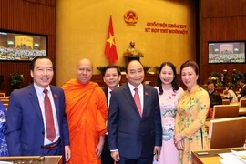 Thủ tướng Nguyễn Xuân Phúc và các đại biểu Quốc hội dự khai mạc kỳ họp lần thứ 11. (Ảnh: Thống Nhất/TTXVN)