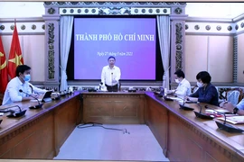 Điểm cầu Thành phố Hồ Chí Minh tham dự họp trực tuyến. (Ảnh: Phạm Kiên/TTXVN)