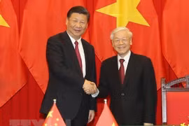 Tổng Bí thư, Chủ tịch nước Nguyễn Phú Trọng (phải) và Tổng Bí thư, Chủ tịch nước Trung Quốc Tập Cận Bình. (Ảnh: Trí Dũng/TTXVN) 