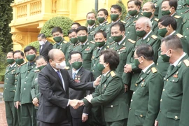 Chủ tịch nước Nguyễn Xuân Phúc gặp mặt đoàn đại biểu doanh nhân là các cựu chiến binh Việt Nam. (Ảnh: Lâm Khánh/TTXVN) 