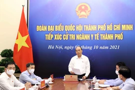 Chủ tịch nước Nguyễn Xuân Phúc phát biểu tại điểm cầu Hà Nội. (Ảnh: Thống Nhất/TTXVN) 