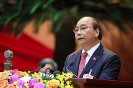Ủy viên Bộ Chính trị, Thủ tướng Chính phủ Nguyễn Xuân Phúc thay mặt Đoàn Chủ tịch đọc Diễn văn khai mạc Đại hội. (Ảnh: TTXVN)