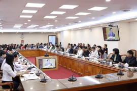 Các đại biểu dự hội nghị tại điểm cầu Thông tấn xã Việt Nam (Hà Nội). (Ảnh: Dương Giang/TTXVN)