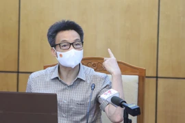 Phó Thủ tướng Vũ Đức Đam chủ trì đầu cầu Bắc Giang. (Ảnh: Danh Lam/TTXVN)